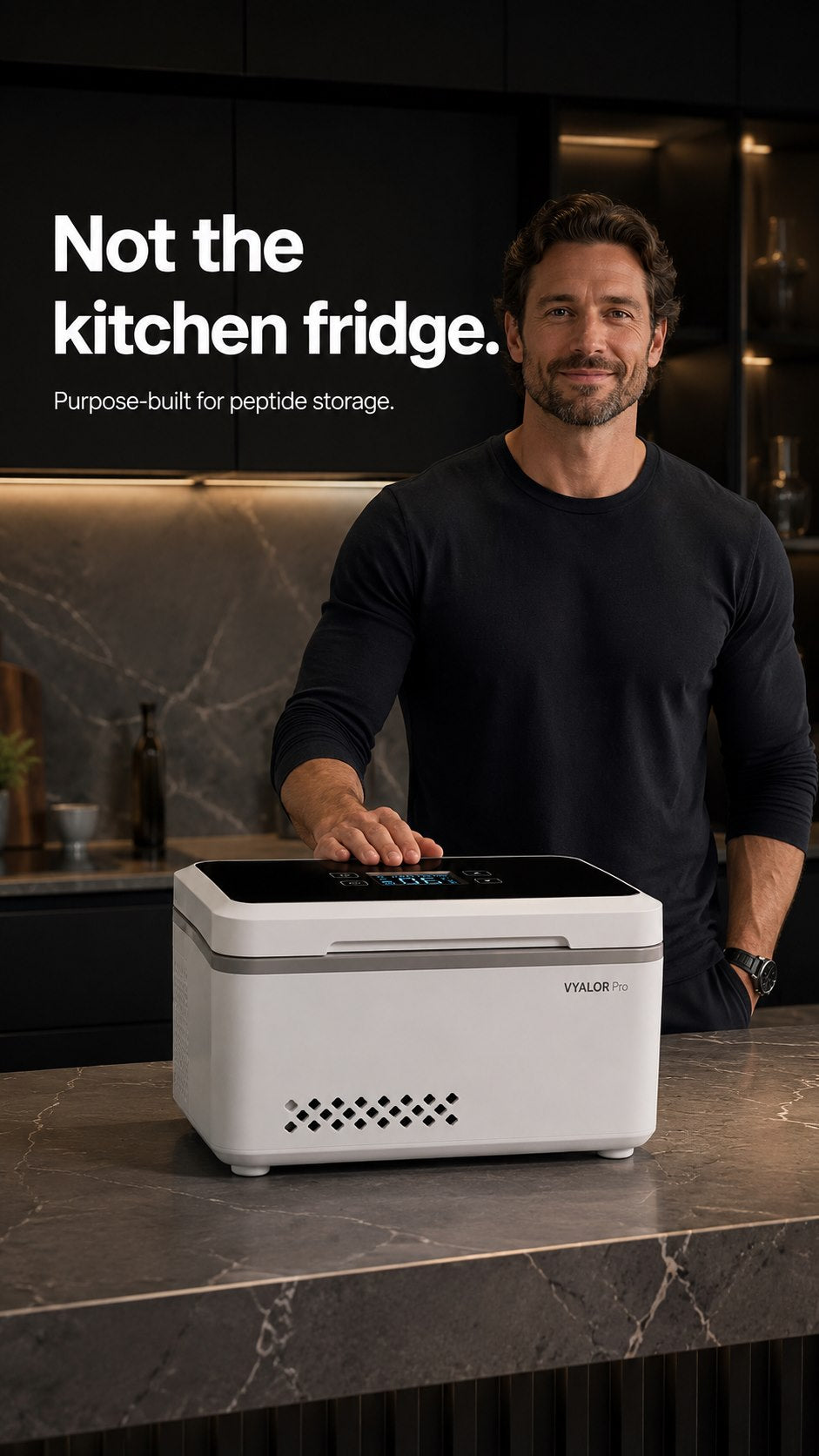 Man standing behind a VYALOR Pro dedicated peptide storage system in a kitchen